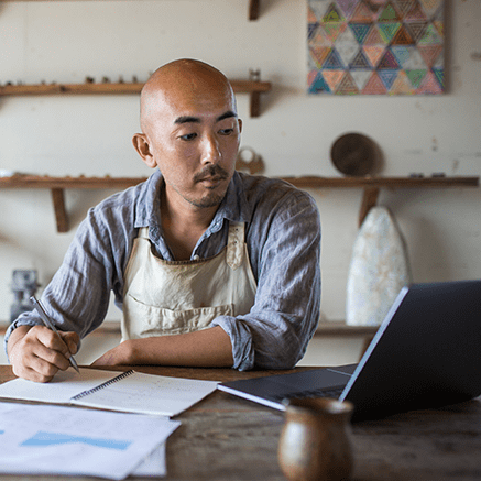 man looking at laptop