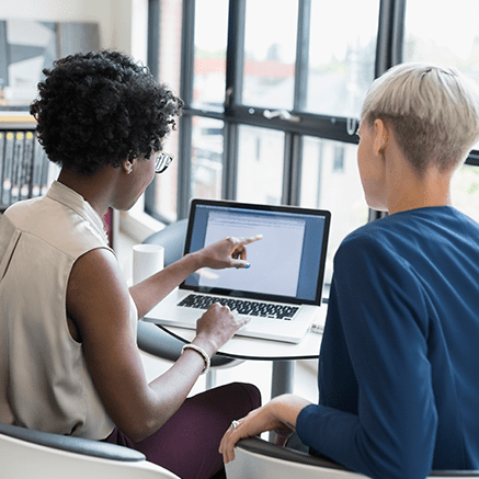 women looking at laptop