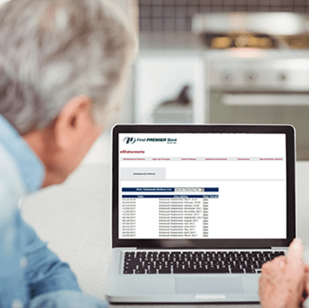 man looking at computer monitor