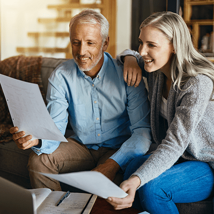 Investing for Everyone couple looking over bank statements