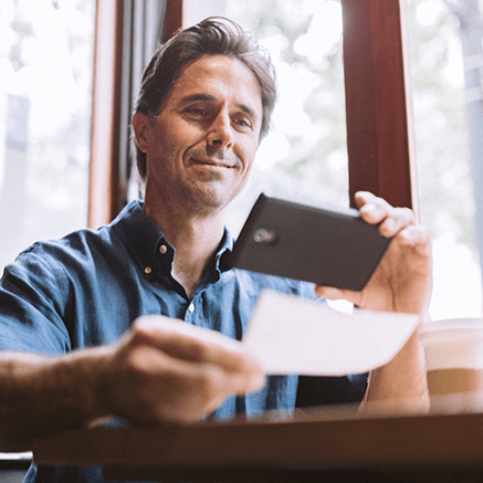 FREE Online & Mobile Banking Man making mobile check deposit