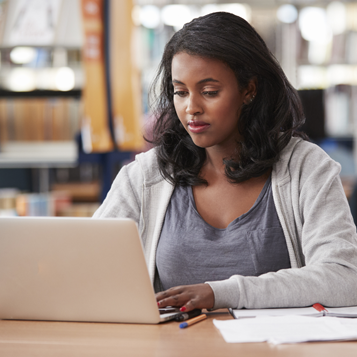 Undergraduate Benefits with Ascent student on laptop