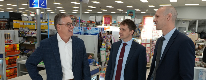 business bankers meeting with customer in drug store