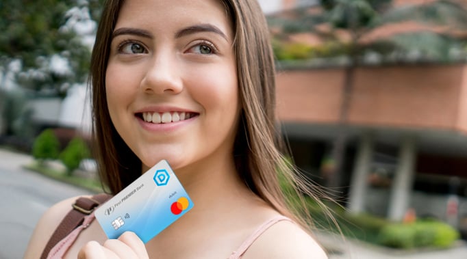 woman looking at credit card