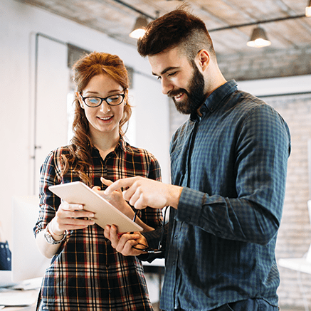 Streamline Employee Payroll & Payments Man and woman looking at tablet