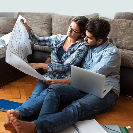 Increase Your Purchasing Power couple looking at house blueprints