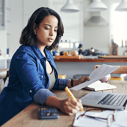 Rates & Requirements woman working at desk