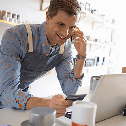 Purchasing Power with Benefits man paying with credit card over phone