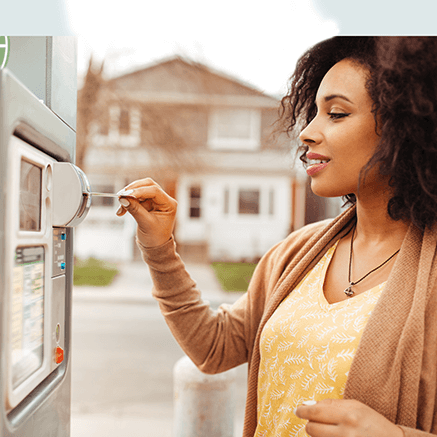 Features woman using credit card to pay for parking