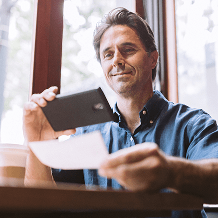 FREE Online & Mobile Banking Male making mobile check deposit