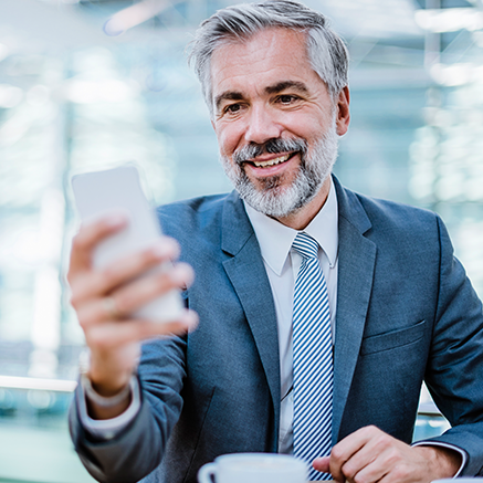 man looking at cell phone