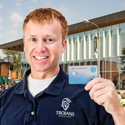 man holding DSU branded debit card