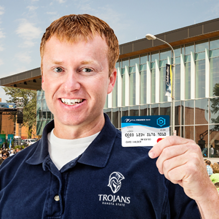 man holding DSU branded debit card