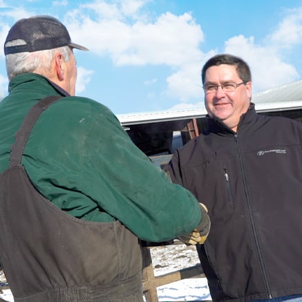 farmer and banker shaking hands