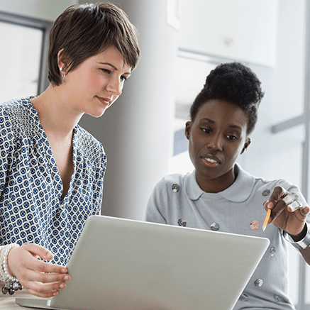 Easy Administration two women looking at laptop