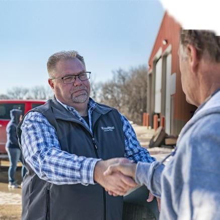 farmer and banker shaking hands