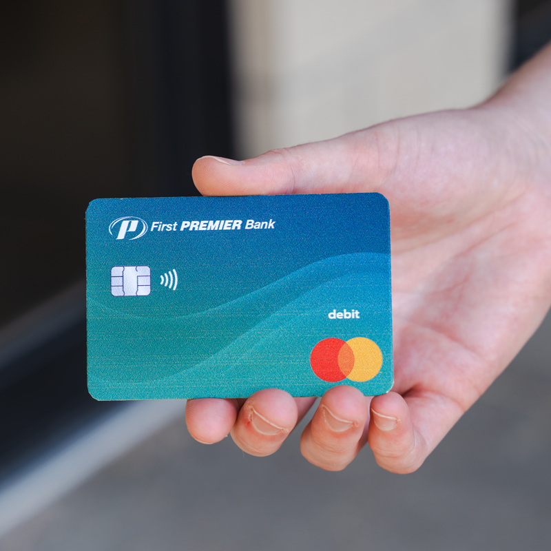 How Your Debit Card Can Benefit You Debit Card held in hand