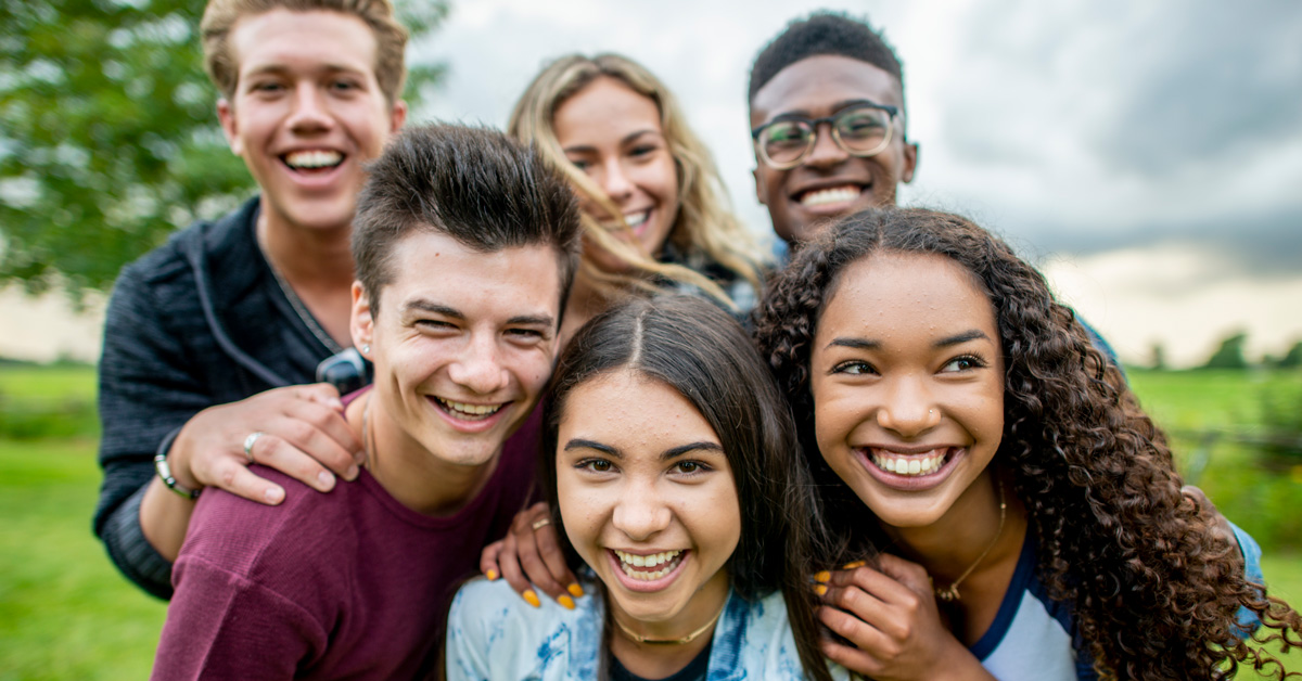 group of teens smiling at the camera